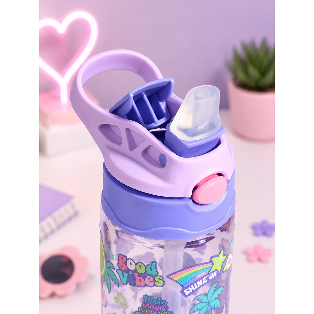 A close-up of a children's water bottle with a purple and lavender lid, featuring a clear flip-top straw lid and a pink button. The bottle has a clear lower section decorated with colorful tropical graphics and the words 'Good Vibes' and 'SHINE ON!'.